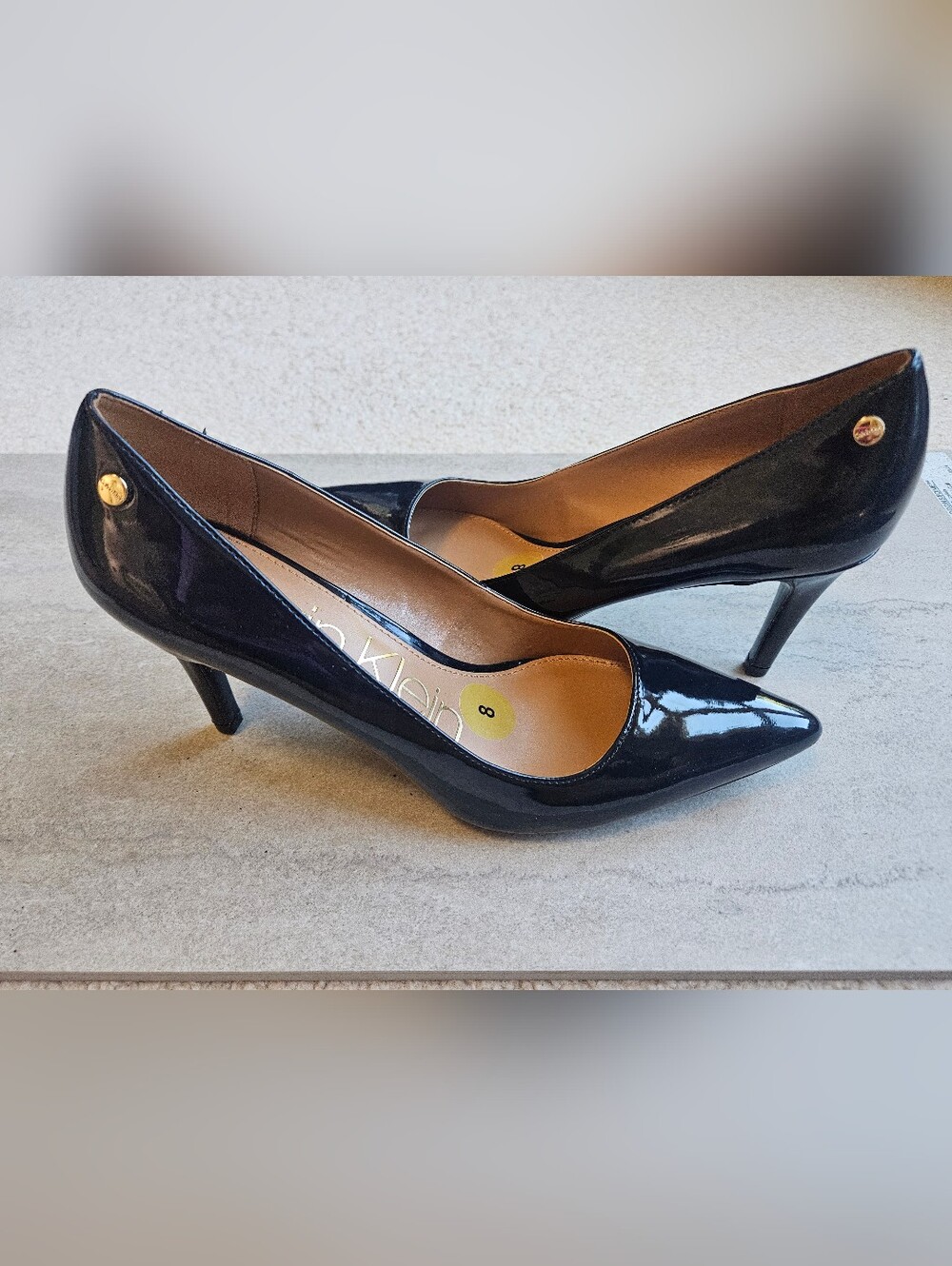 Calvin Klein Black Patent Pointed Toe Pumps with Gold Logo